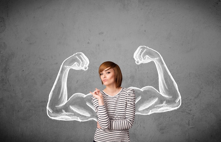 woman in a striped shirt standing in front of drawn muscular arms