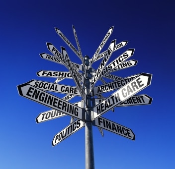 street sign with many signs attached to it pointing to different career paths